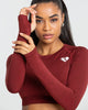 MOVE SEAMLESS LONG SLEEVE CROP TOP | RUBY RED SOLID